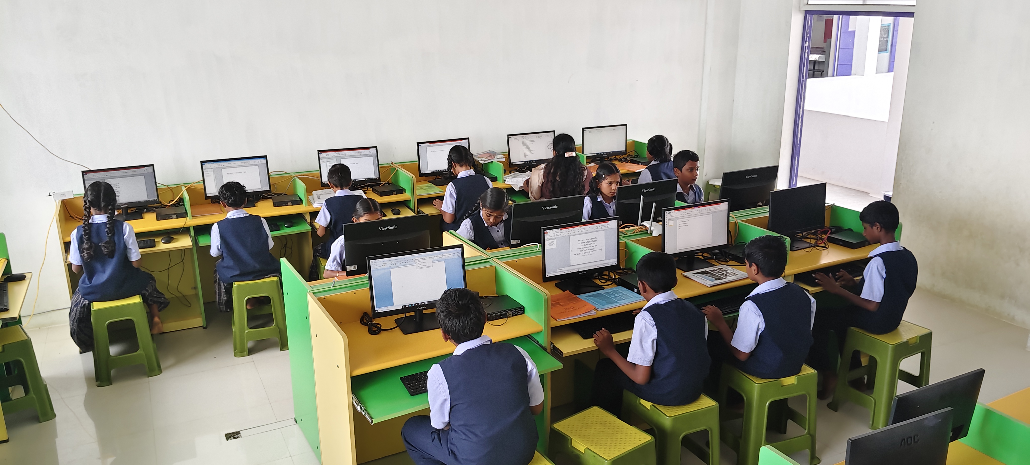 Students and a teacher together in a classroom